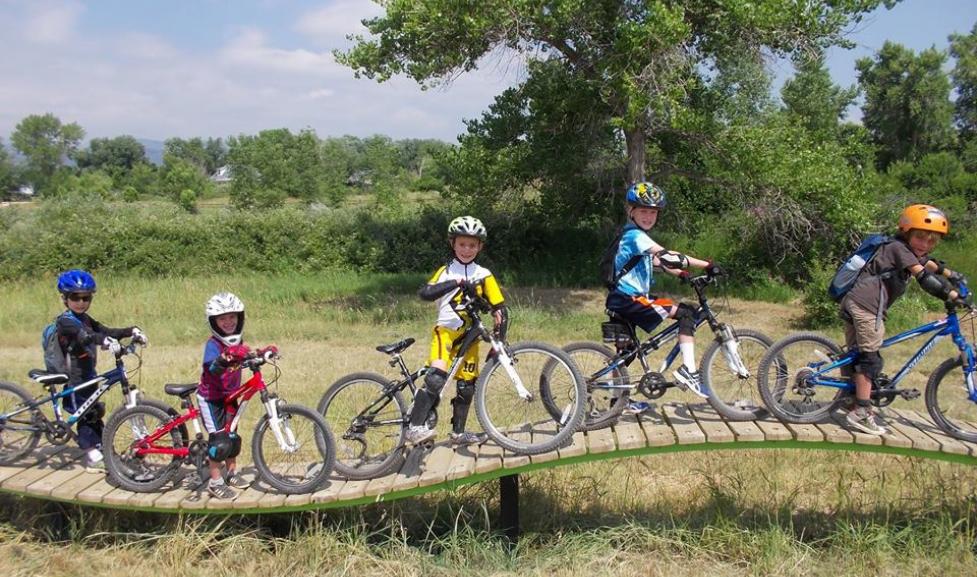Five kids with their bikes at an Avid4Adventure program at Valmont Bike Park